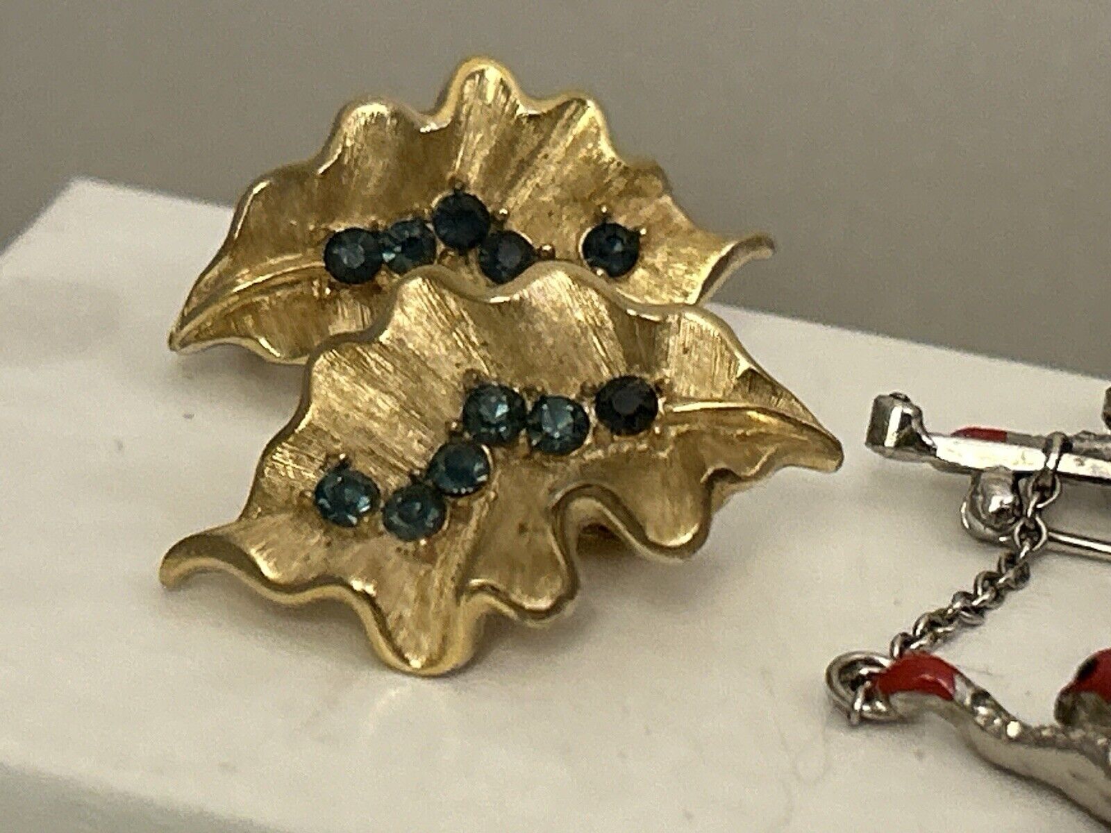 Vintage Crown Trifari Earrings Montana Blue & Gold Rhinestones Ruffled Leaf - Vintage Jewelry Collective