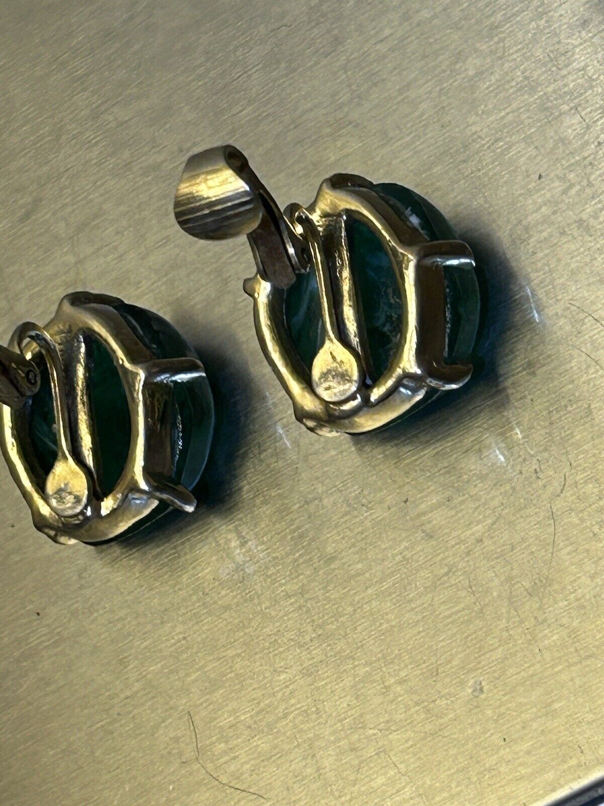 Vintage Flawed Emerald Glass Rhinestone Clip Earrings Signed Can’t Make Out - Vintage Jewelry Collective